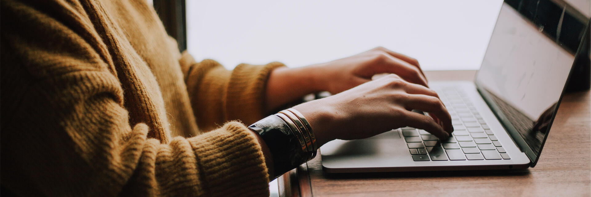 Female student working on their computer